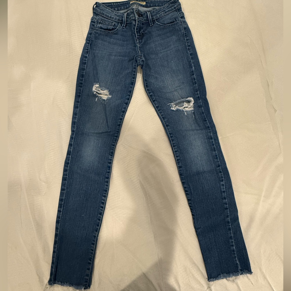 Guess jeans, size 24 low to midrise with distressing
